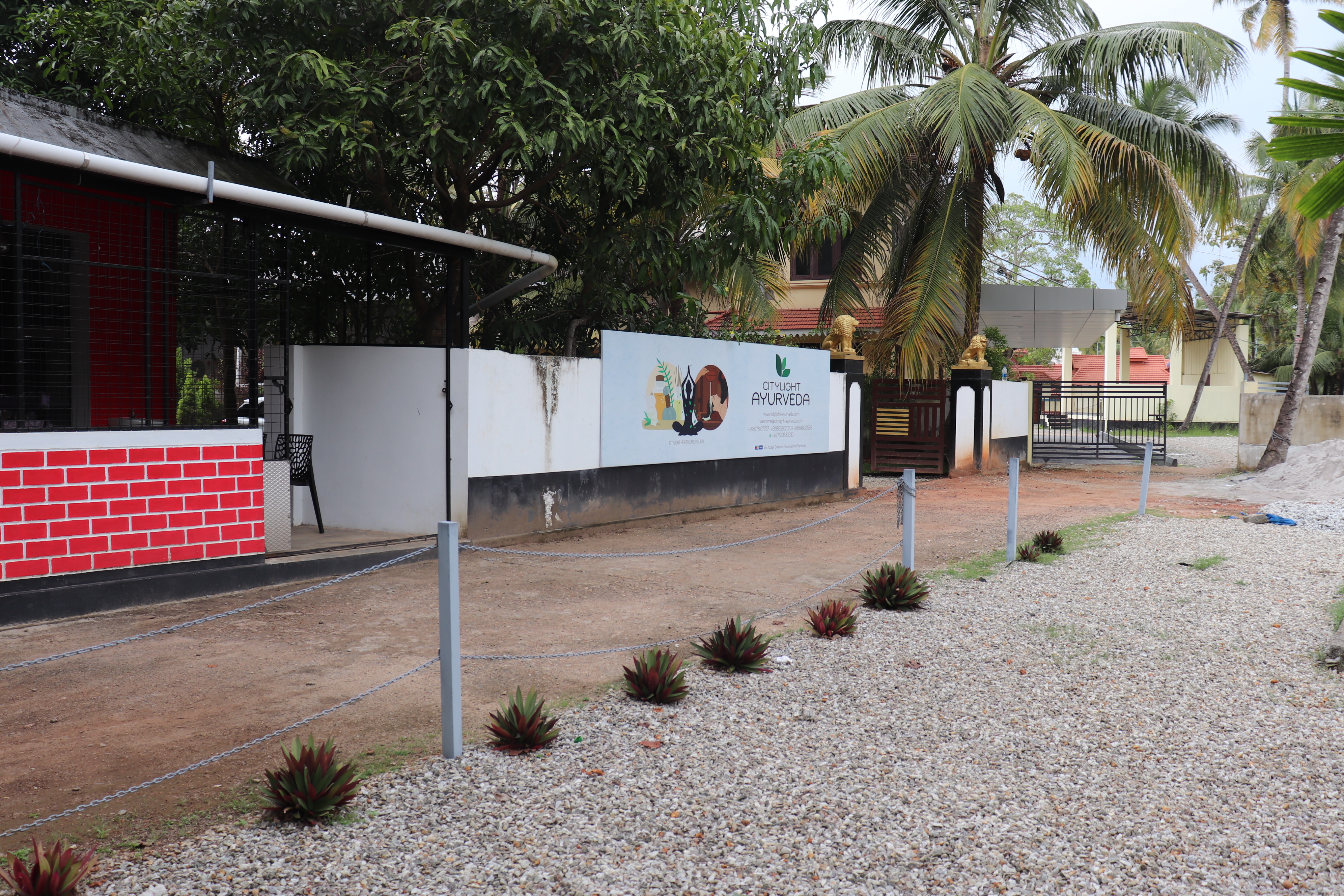 Property surroundings with garden path and tropical trees